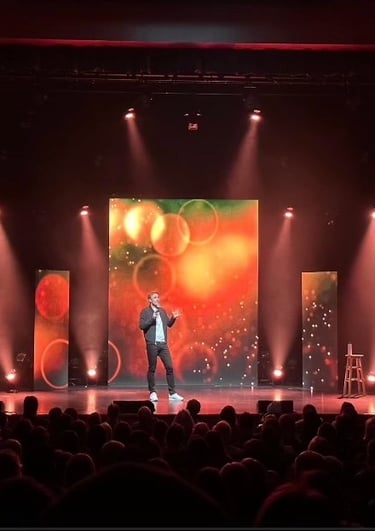 Stage with light and a person who talk to the crowd