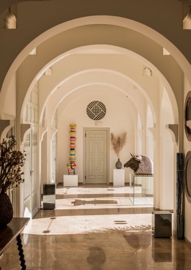 Interior view of an arched hallway at Villa El Rincon