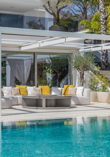 Pool area at Villa Serenity featuring modern furnishings, sunbathing lounges, and chill-out areas