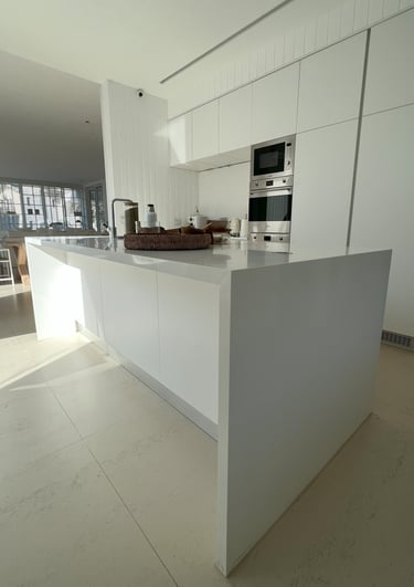 a kitchen with a large island style counter top