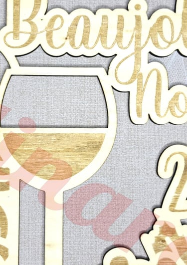 a wooden plaque with a wine glass and a bottle of wine