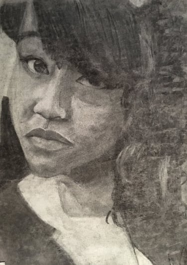 charcoal self portrait. black girl artist