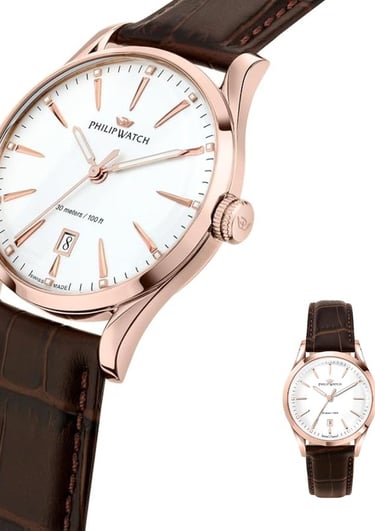 a watch with a white dial and a brown leather strap