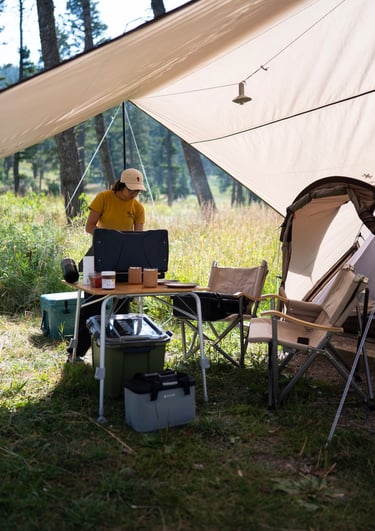 A woman cooking while camping
