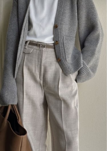 a man in a white shirt and gray pants