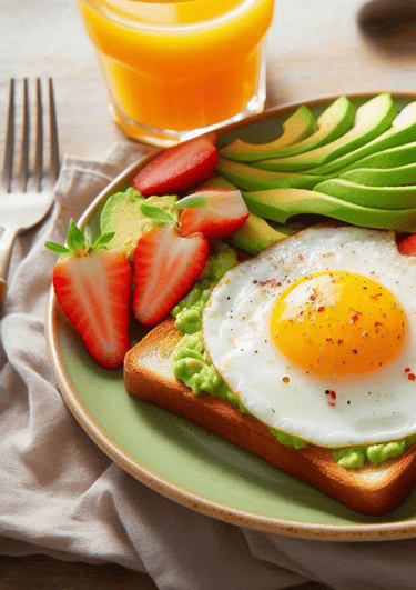 a plate of food with fruit and a glass of juice