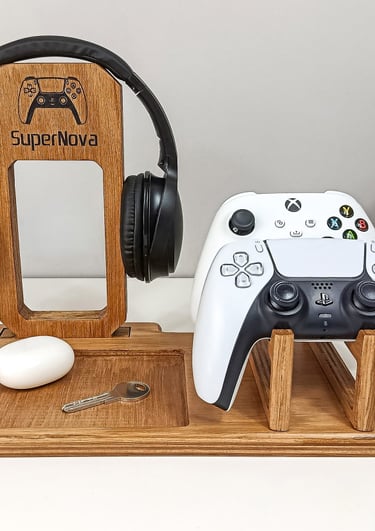 a wooden desk with a controller and headphones
