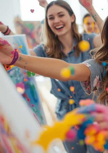 group of people splashing paint in studio
