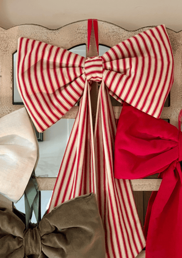 A large red stripe fabric bow 