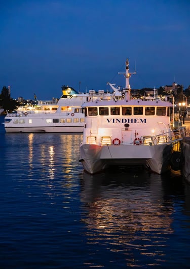 a boat in the water with a boat in the background