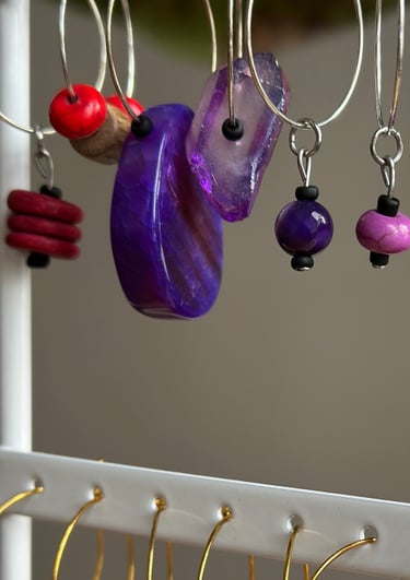 assorted purple gemstone wine charms