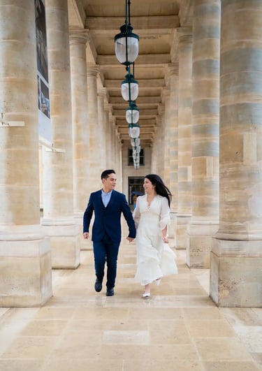 a bride and groom walking down a hallway