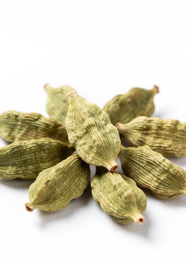 Whole cardamom pods spilling out of a small rustic bowl on a linen cloth