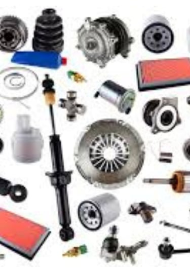 A collection of various car parts including shock absorbers, air filters, and engine components for auto repair.