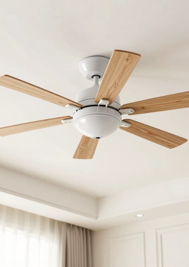 A sleek ceiling fan spinning gently in a bright, airy room.