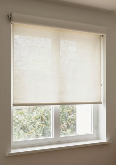Close-up of elegant roller shades softly filtering sunlight in a modern living room.