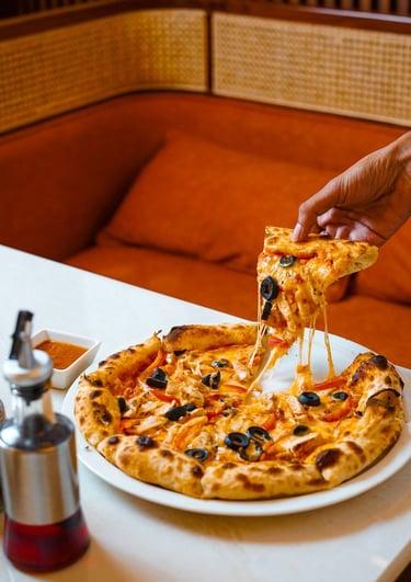 Wood fired pizza served at Haloz Pizzeria Lucknow