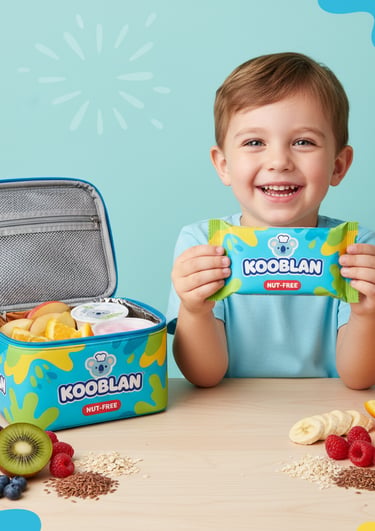 A happy child smiling while holding a Kooblan nut-free snack bar next to an open Kooblan-branded lun