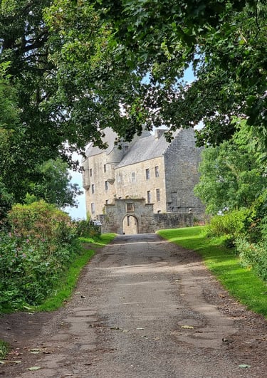 Midhope Castle (Lallybroch) framed by trees
