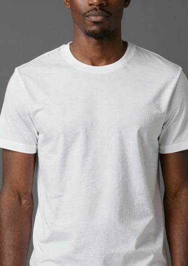 A casual crewneck sweatshirt folded neatly on a rustic table with a backdrop of greenery.