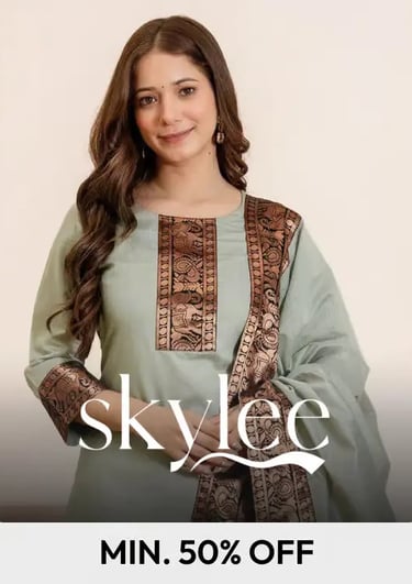 Woman wearing a light green Skylee brand ethnic kurti set with bronze embroidered borders and dupatta.