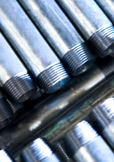 Close-up of high-grade galvanized iron (G.I.) nipples with clean threads