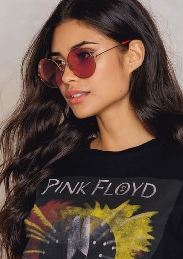 a woman wearing a black shirt and sunglasses