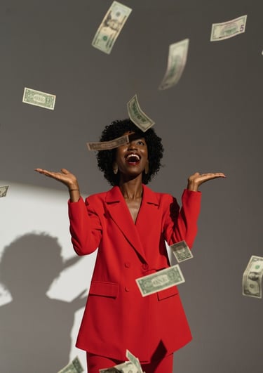 a woman in a red suit and sunglasses is standing in front of a wall with