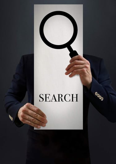 a man in a suit holding a sign that says search