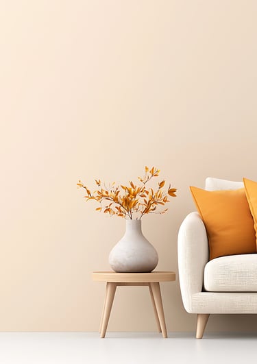 white therapy couch with orange pillows and a side table with flowers