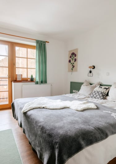 a bed with a blanket on top of it
