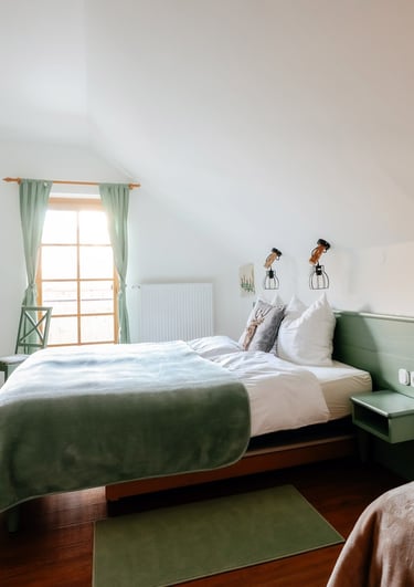 a woman in a white dress standing in a bedroom