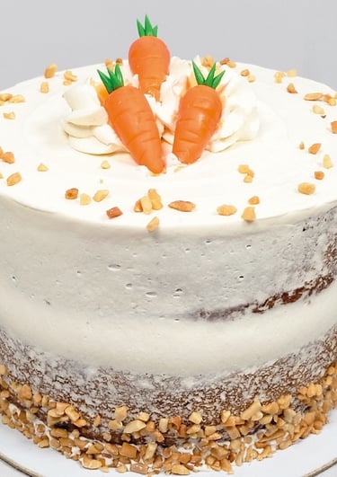 a carrot cake with carrots and nuts on top