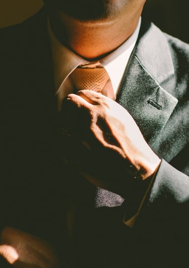 Executive is fixing his tie