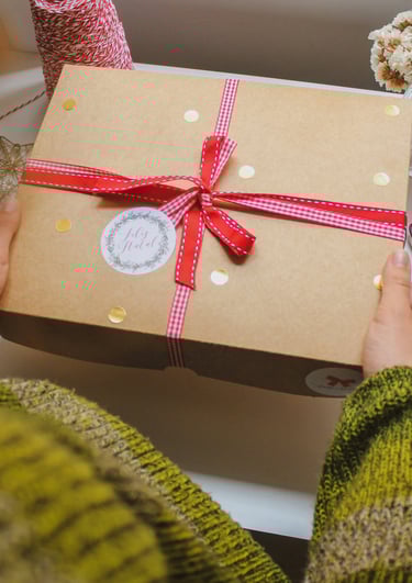 Woman is holding a gift box