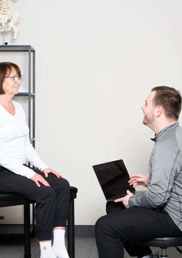 Practitioner educating patient at JD Osteopathy Mississauga