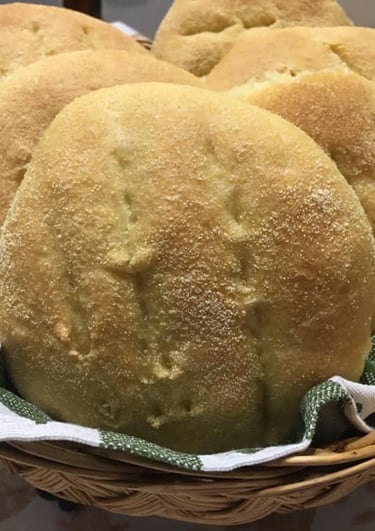 a basket of breaded bread rolls in a basket