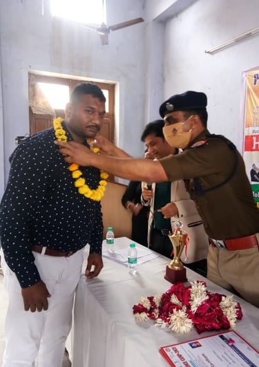 a man in uniform is being awarded by a man in uniform