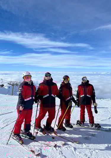 a group of skiers posing for a picture
