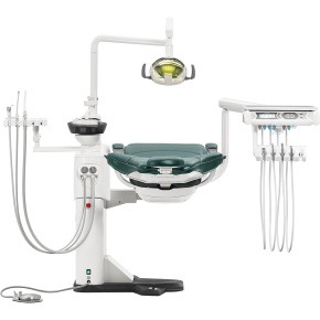 Professional hydraulic dental chair with overhead light and integrated instrument delivery system.