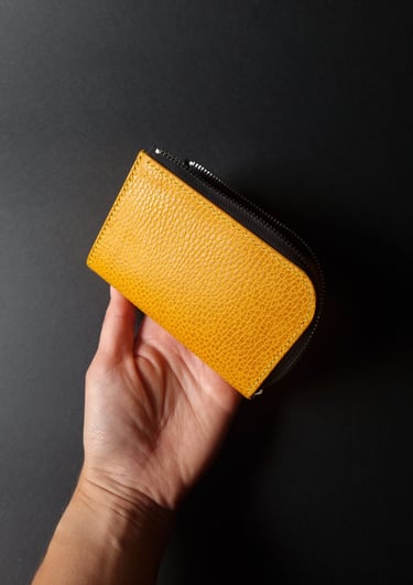 Yellow grained L-shape wallet with zipper closure