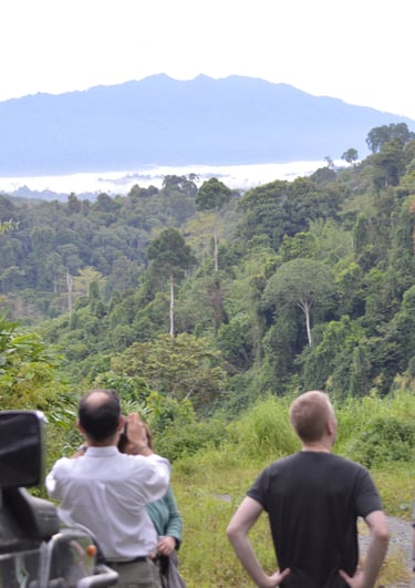 a group of people standing around a vehicle