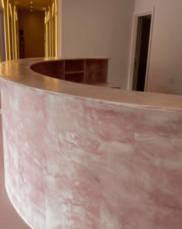 A pedicure station featuring a rose design in a modern spa, with warm LED lighting.