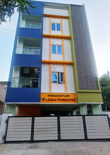 Sundaram Flats by Legha Foundation, a modern multi-story residential apartment building with a colorful facade.