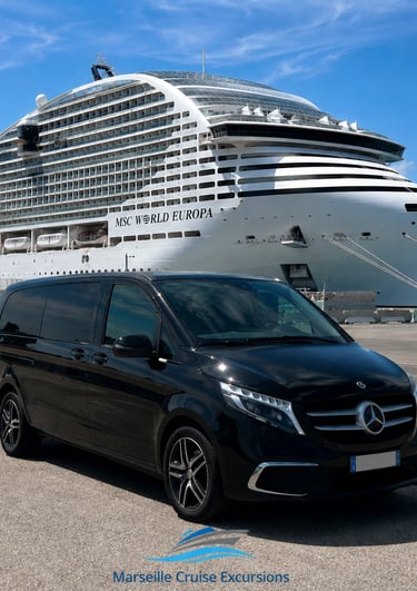 Black Mercedes van parked at a port for Marseille cruise excursions with the MSC World Europa ship behind.