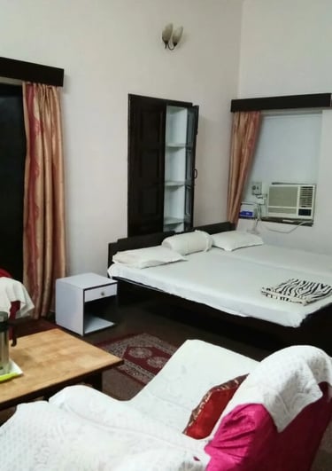 a bedroom with a bed and a couch