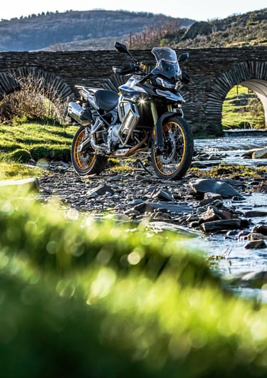 a person riding a motorcycle on a dirt road
