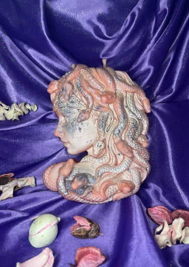 a statue of a woman with a head of snake hair