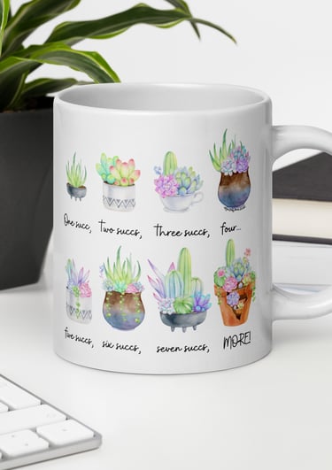 White succulent-themed ceramic mug with colorful plant illustrations — Miss Chatty Plants drinkware collection.