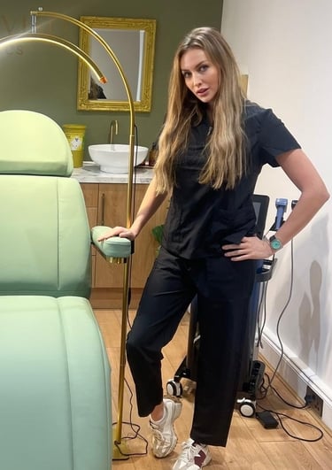 a woman standing in front of a chair 